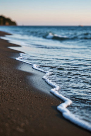 The natural scene of waves crashing on the beachの素材