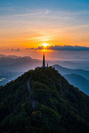 Panoramic view of sunrise over the mountaintop buildingの素材