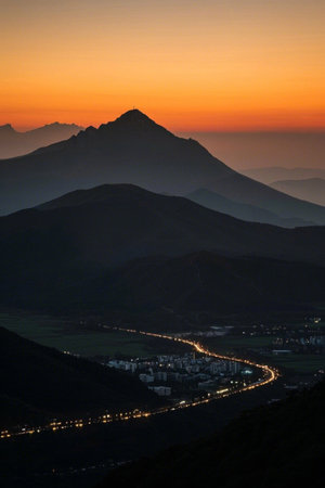 Landscape of mountains and town roads at sunsetの素材
