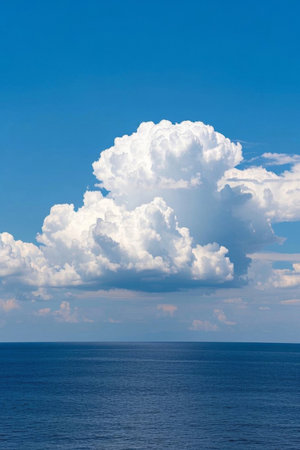 Fluffy clouds on the blue sky and seaの素材
