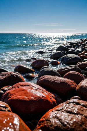 Colorful rocks and sparkling sea by the seaの素材