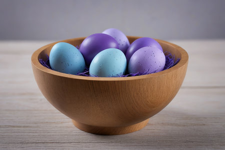 Colorful decorated eggs in a wooden bowlの素材