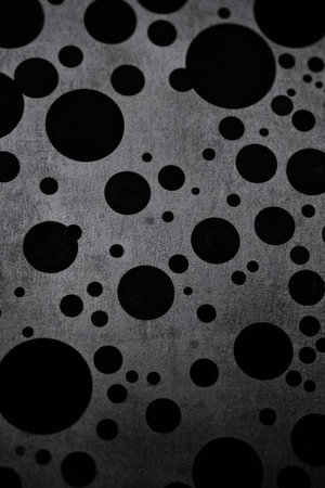 Abstract polka dot pattern on black backgroundの素材