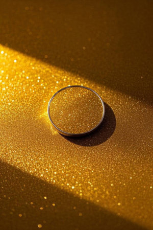 Close up of the ring on gold backgroundの素材