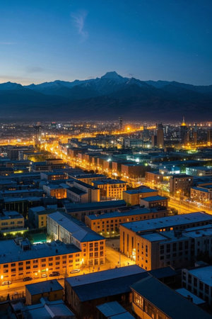 City night view and distant view of snow capped mountainsの素材