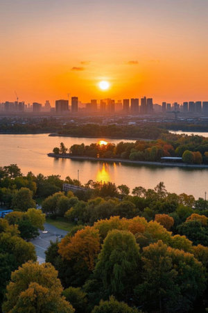 Sunset by the lake Panoramic view of the city skylineの素材