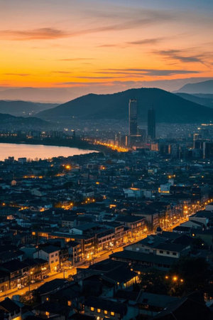 City sunset panorama with mountain and lake viewsの素材