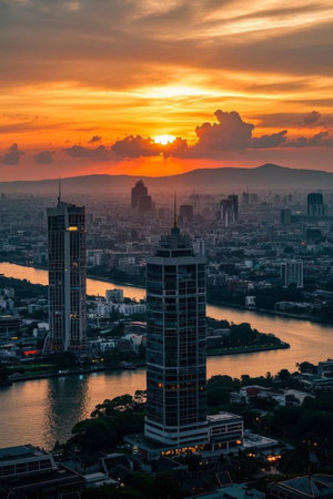 High rise buildings and river views at sunset in the cityの素材