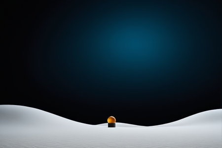 Orange sphere on white sand dunes on blue backgroundの素材