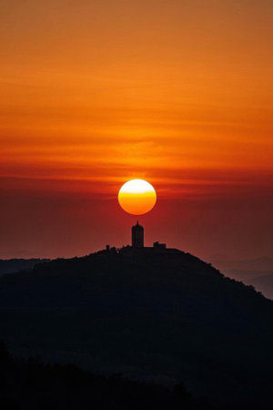 Mountaintop sunset and architectural silhouetteの素材