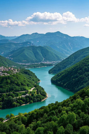 River valley scenery surrounded by green mountains and green watersの素材