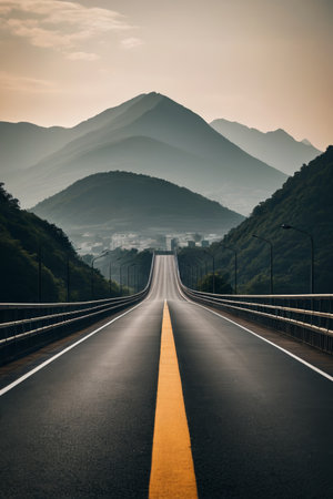 Scenery of the open road in front of the distant mountainsの素材