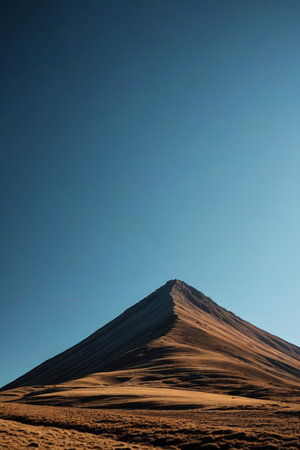 Cone shaped hill scenery under the blue skyの素材