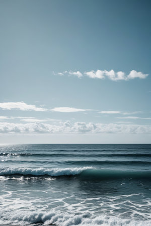 Sea view of waves under blue sky and white cloudsの素材