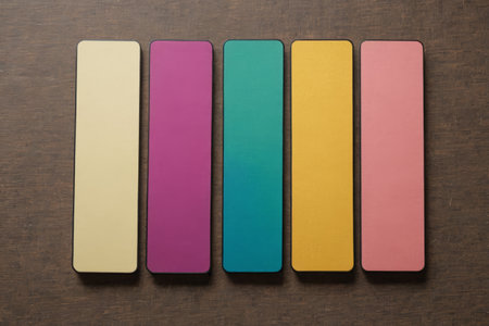 Colorful rectangular objects arranged on wooden surfaceの素材