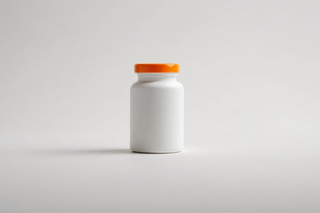 White medicine bottle with orange bottle gate writingの素材