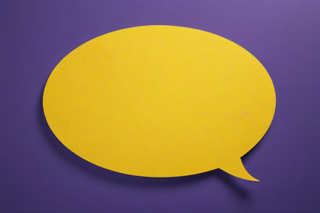 Yellow conversation bubbles on a purple backgroundの素材