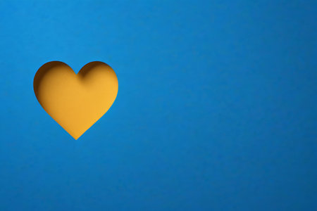 Yellow heart pattern on blue backgroundの素材
