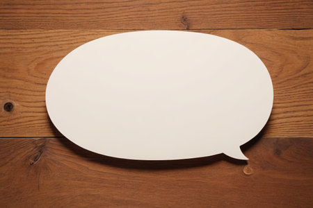 Blank dialogue bubbles on wooden backgroundの素材