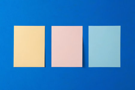 Three color paper on a blue backgroundの素材