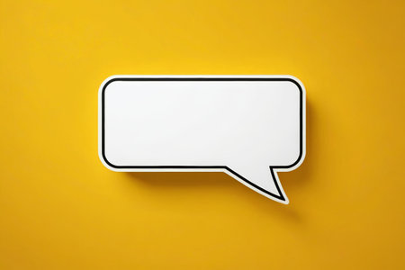 White dialog bubbles on yellow backgroundの素材