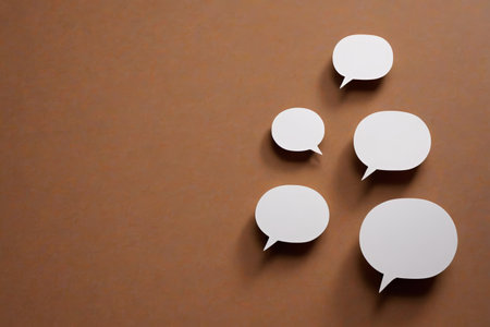 White dialog bubbles on brown backgroundの素材
