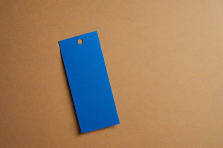 Blue paper label on brown backgroundの素材