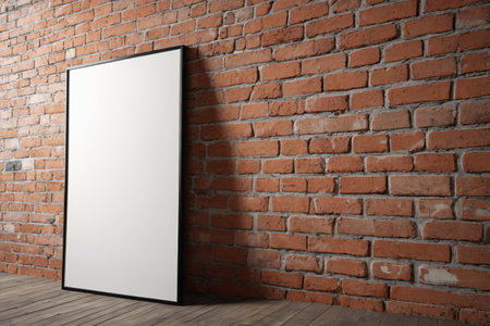 Wall facing blank frame with red brick backgroundの素材