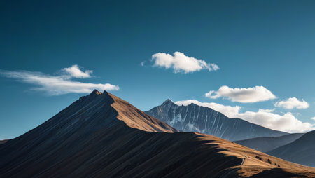 Magnificent mountain scenery under blue sky and white cloudsの素材