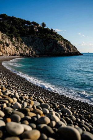 Pebbled beach by the sea and distant cliffsの素材