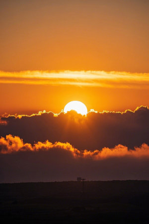 Sky clouds and sun landscape at sunsetの素材