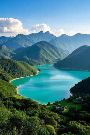 Blue green lake scenery surrounded by green mountainsの素材
