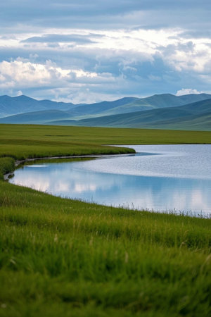 Grassland lakes and distant mountains natural landscapeの素材