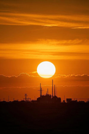 Industrial facilities and solar landscape at sunsetの素材