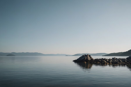 Calm lake and distant mountain landscapeの素材