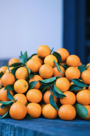 Stacked fresh leafy orangesの素材