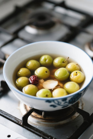 Fruit soup in a bowl on a gas stoveの素材