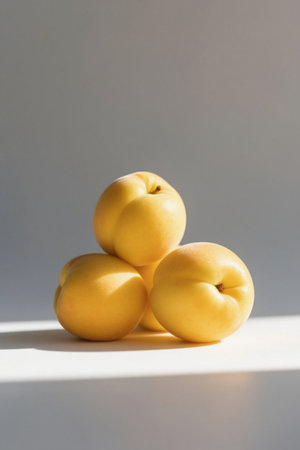 Stacked bright yellow ripe apricotsの素材