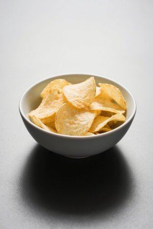 Close up of potato chips in a bowlの素材