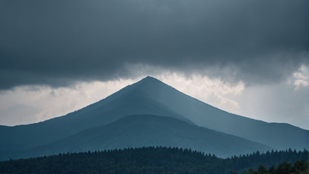 Mountains and forest landscapes shrouded in dark cloudsの素材