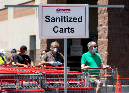 Cypress, CA / USA - May 3, 2020: COVID-19 pandemic forces changes in shopping: a sign directs...