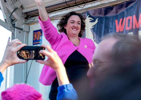 Santa Ana, CA / USA - Jan 18, 2020: U.S. Representative Katie Porter (D) takes to the stage and greets the eager crowd below at the start of the Orange County Womenâs March.のeditorial素材