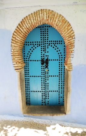 chefchaouen doorway 2, a studded blue wooden doorway in Chefchaouen, Moroccoの写真素材