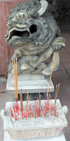 Chinese temple 2, traditional stone lion statue guarding a Chinese temple in Penang, Malaysiaの写真素材