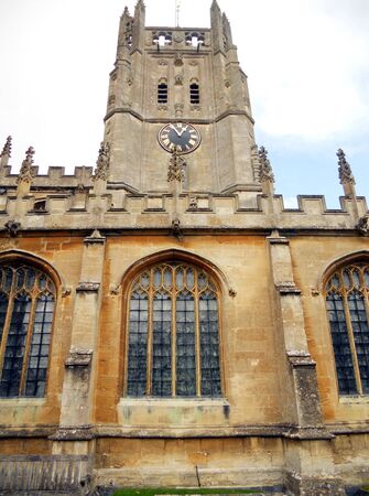 Fairford church, view of the side and spire of St  Marys 15th Century church, Fairford, Gloucestershire, UKの写真素材