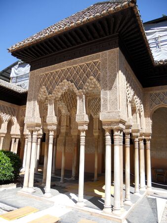 Granada palace 4, carved plasterwork, pillars, arches and architecture in a courtyward inside the Alhambra Palace, Granada, Spain のeditorial素材