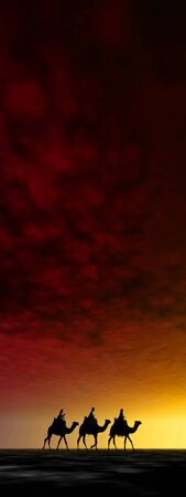 3 kings sunset 19b, Christmas card image of the 3 kings on camels, silhouetted against a beautiful warm sunsetの写真素材