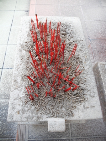 red incense - Penang 2, burned sticks of red incense and gray ash on a pale stone holder in a Chinese temple, Penang, Malaysia, Asiaの写真素材