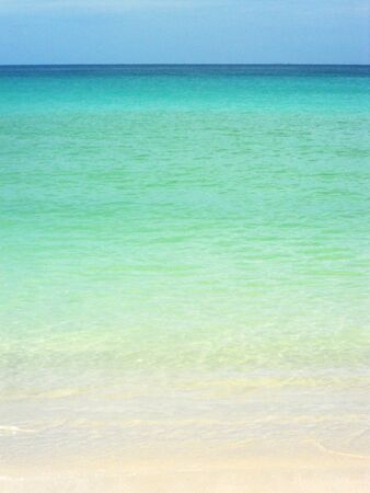 tropical beach 3, Beautiful gradation of tropical ocean and beach, from dark blue distant waters, through glowing turquoise and green ocean, to delicate pale sandsの写真素材