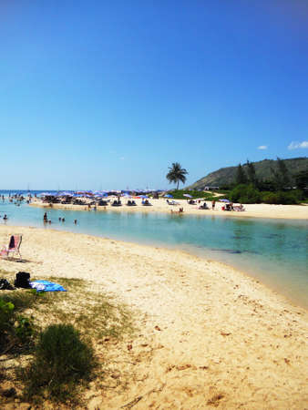 tropical beach 9, tropical beach  Naiharn, Phuket, Thailand  with beach umbrellas, pale sand and touristsの写真素材